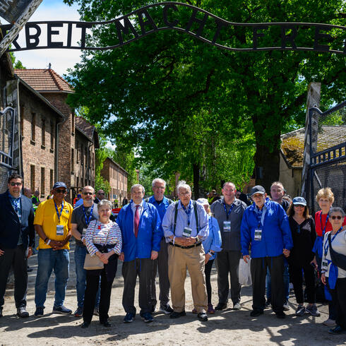 YU President Berman (center) leads a delegation of university presidents to Auschwitz for the 2024 International March of the Living